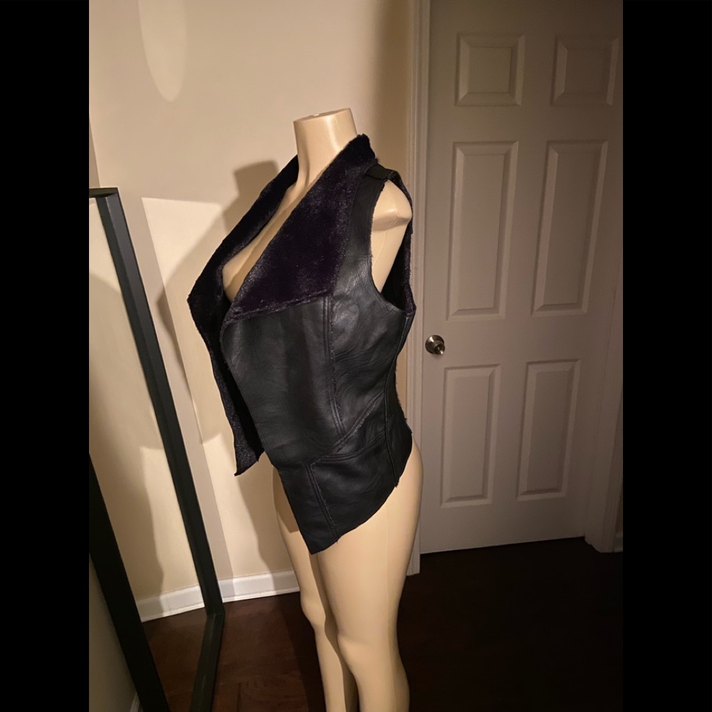 Leather vest with fur lining and trimmings